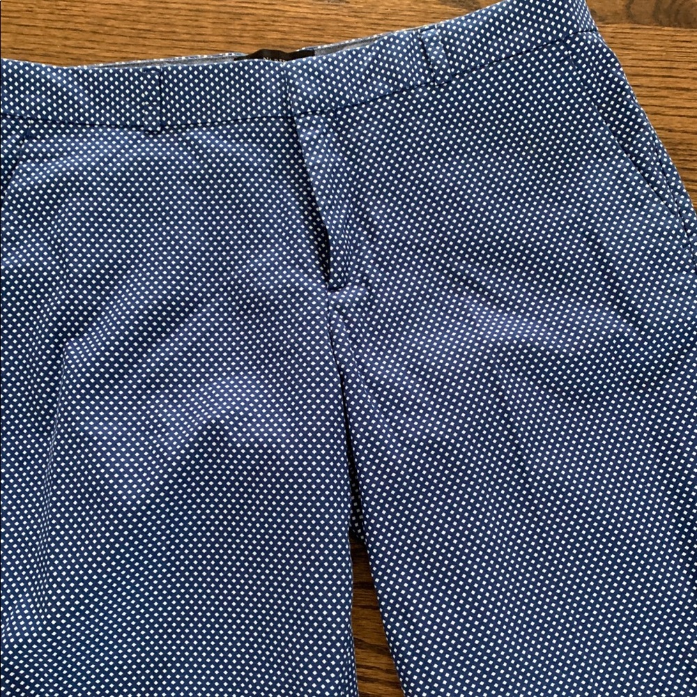 Navy blue with white diamond print shorts.